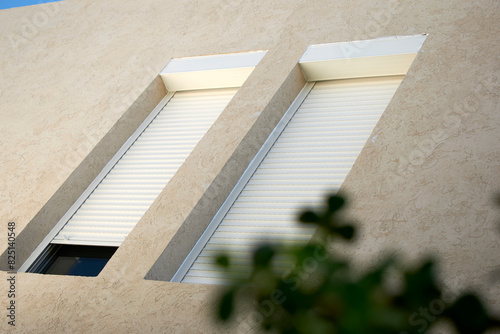 house facade with exterior shutters 
drawer and injected blind system