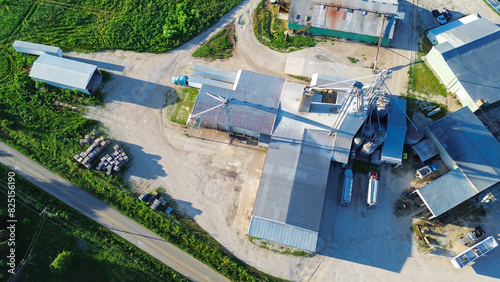 Grain silos, griding machines, warehouses, storage tanks of large feed and fertilizer mill, agro processing plant in Mountain Grove, South Central Missouri, agricultural service facility, aerial