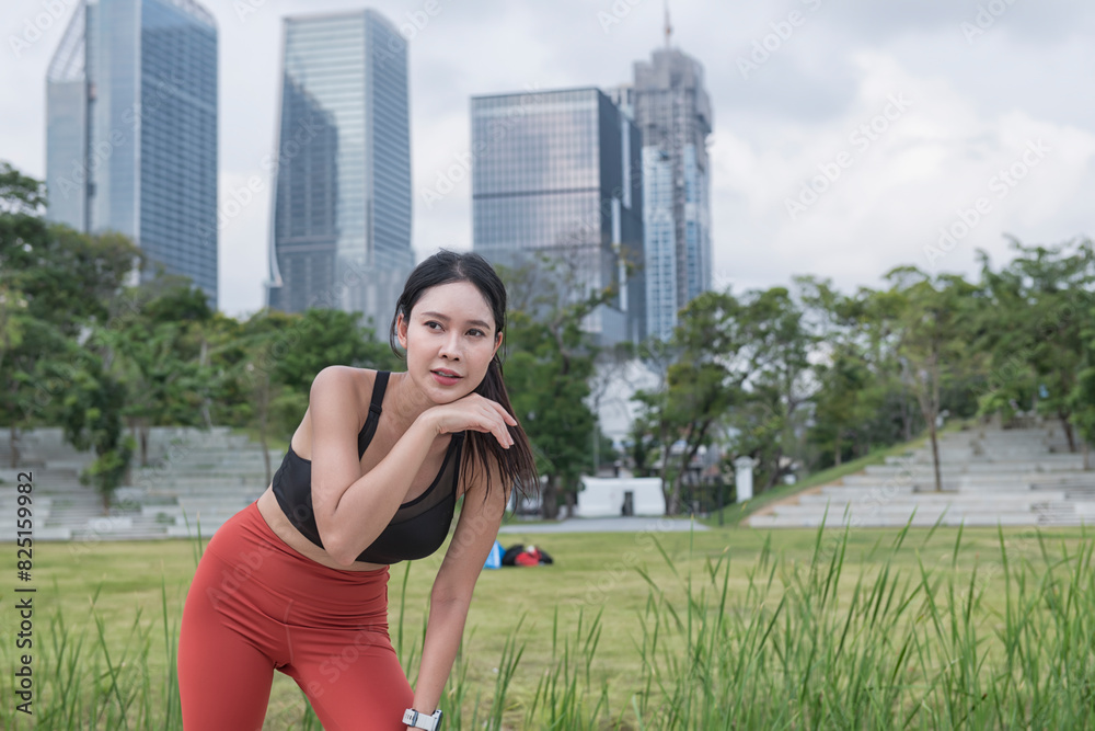 Sport woman in park. sport woman Asian get tired while running in the park. Sport woman in park. sport woman Asian get tired while running in the park.