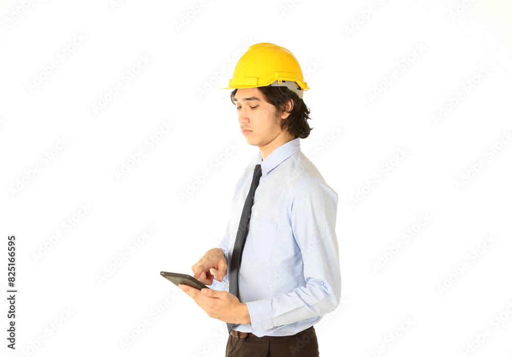 Portrait of young engineer ordering with tablet over white background Portrait of young engineer ordering with tablet over white background