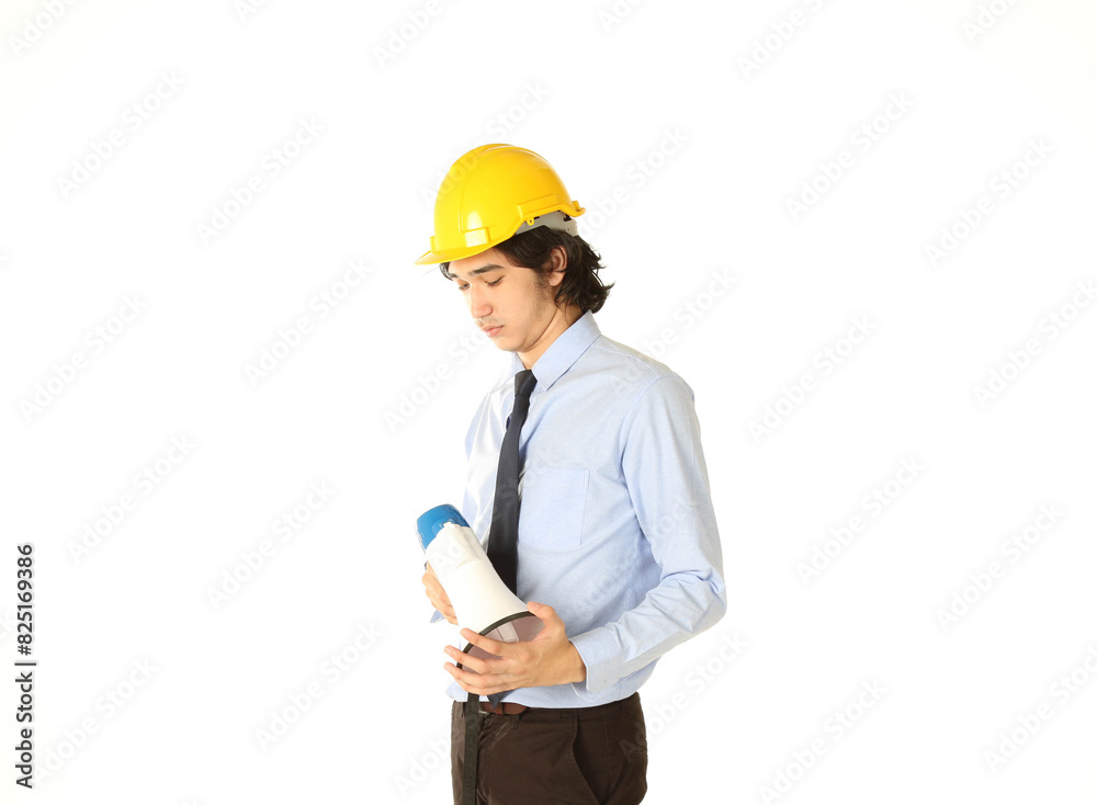 Portrait of young engineer wear yellow safety helmet hold the megaphone, over white background Portrait of young engineer wear yellow safety helmet hold the megaphone, over white background