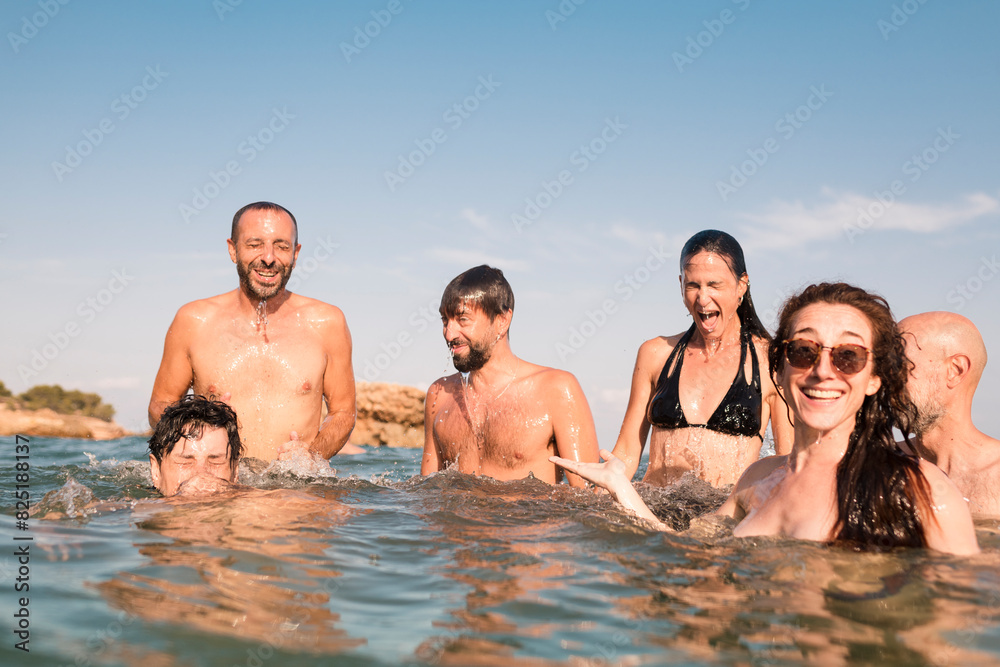 Summertime happiness with friends in the sea Summertime happiness with friends in the sea