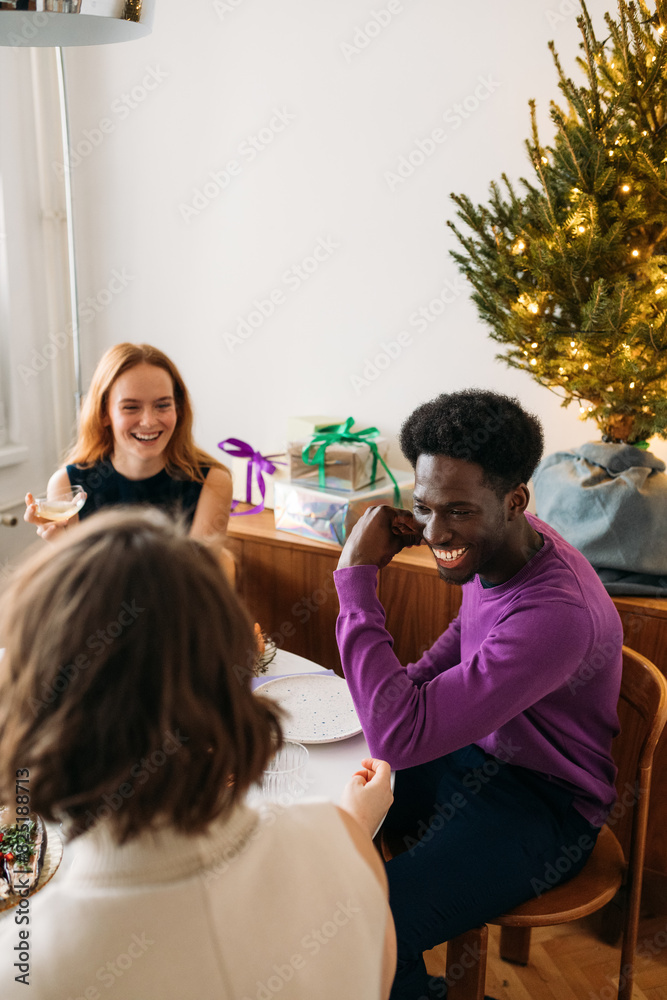 Friends enjoying Christmas lunch Friends enjoying Christmas lunch