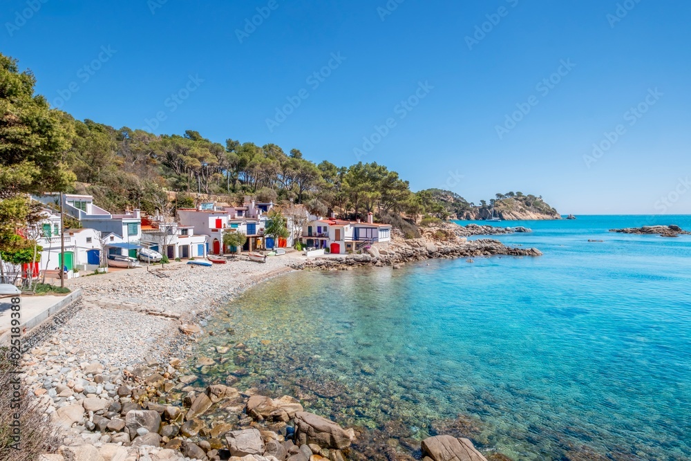 View of a small fishing village on the Costa Brava, in Girona, Catalonia. Mediterranean, on the shore of a rocky beach. View of a small fishing village on the Costa Brava, in Girona, Catalonia. Mediterranean, on the shore of a rocky beach.