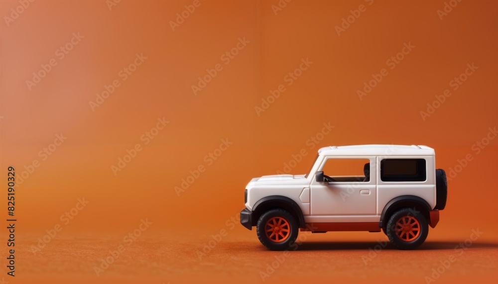 Boxy electric toy SUV on terracotta orange background with copy space