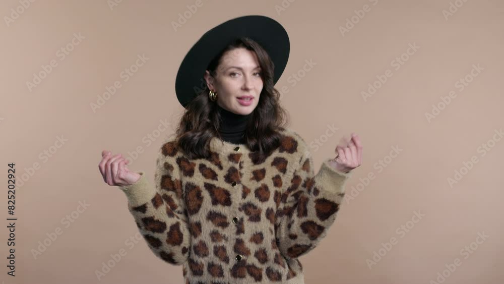 Mature woman with money gesture on studio background. Smart lady smiles slyly Mature woman with money gesture on studio background. Smart lady smiles slyly
