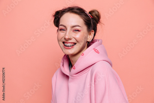 Cheerful woman with closed eyes in studio photo