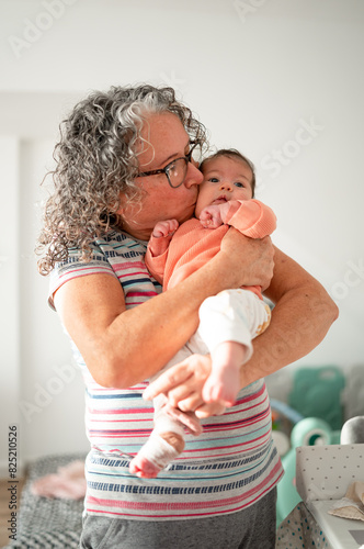 Loving Grandmother Kissing Baby