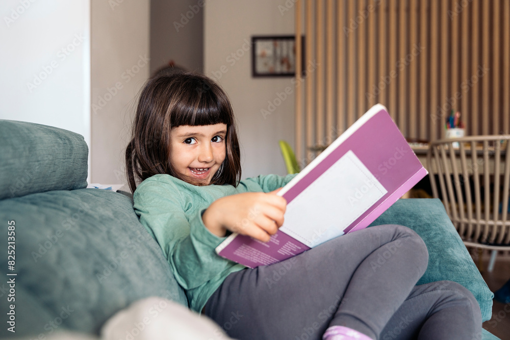 Little Girl Enjoying Reading Little Girl Enjoying Reading