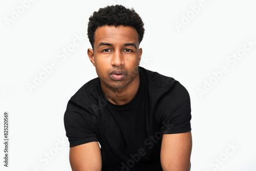 Reflective Young Man in Studio photo