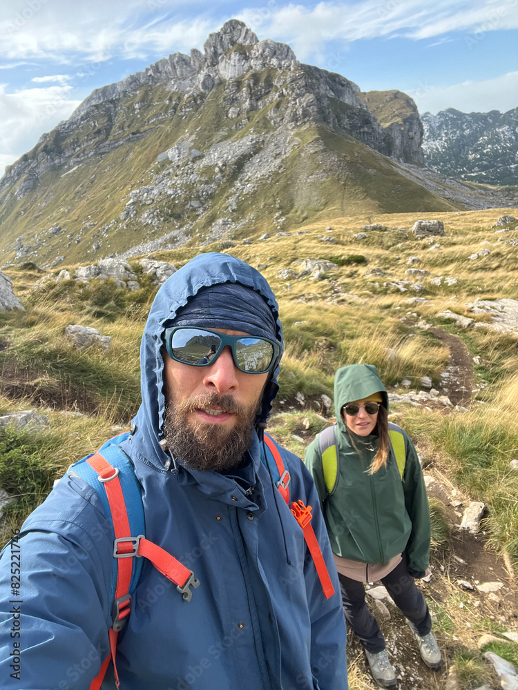 Couple taking a selfie during mountain hike Couple taking a selfie during mountain hike