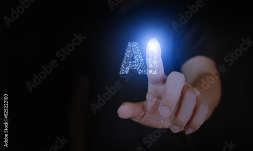 AI, artificial intelligence, a man's hand touching a circuit Ai letters to activate or to use it.