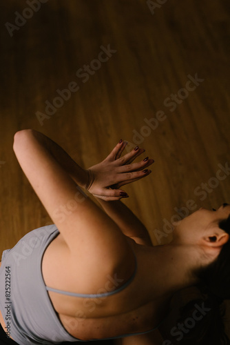 A woman stretches the muscles in her forearms and hands photo