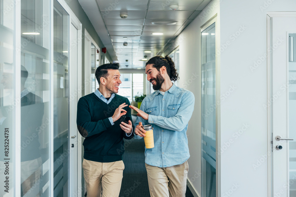 Casual business discussion in a modern office space Casual business discussion in a modern office space