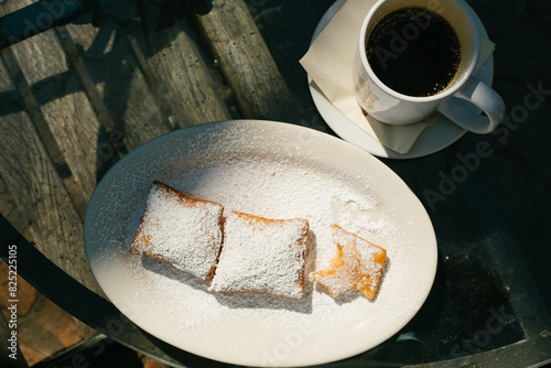Beignets and Coffee on Cafe Table photo