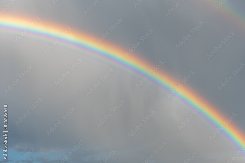 Rainbow appearing in rainy clouds in spring. Rainbow appearing in rainy clouds in spring.
