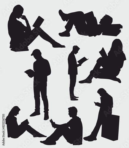 Silhouettes of people reading book.