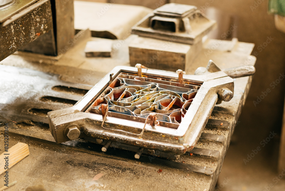 Close-Up of Industrial Cement Tile Mold on Workbench in Daylight Close-Up of Industrial Cement Tile Mold on Workbench in Daylight