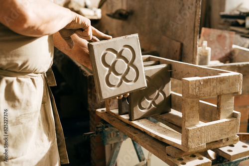 Canvas Print Close-up of Skilled Craftsman Hands Placing Barcelona Panot Hydraulic Tile on Dr