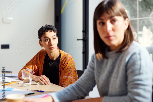 Two attentive businesswomen during a conversation in the office