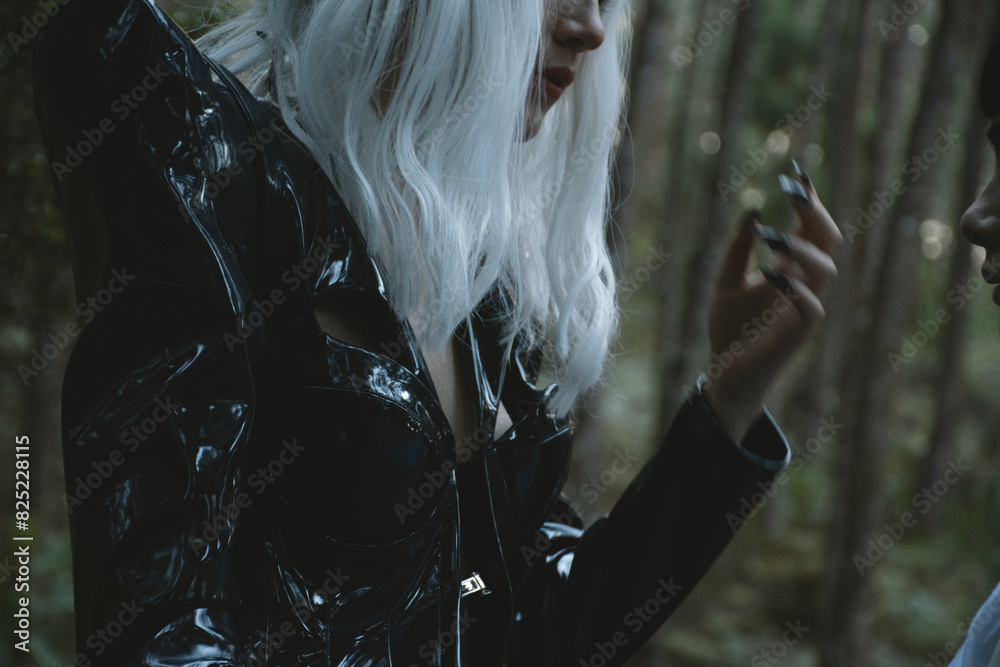 © Laura Herrera/Stocksy - Futuristic Woman in Black Costume with White Wig in a Forest Sunset © Laura Herrera/Stocksy - Futuristic Woman in Black Costume with White Wig in a Forest Sunset