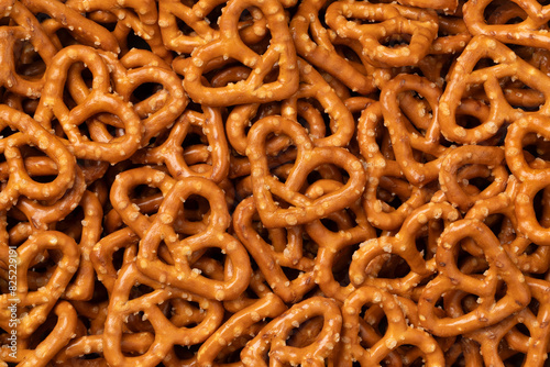 Salted pretzel hearts full frame as background close up