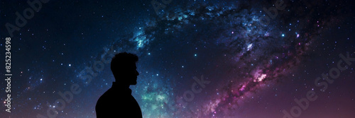 Wallpaper Mural A silhouette of a person is outlined against a vast starry sky, evoking a sense of wonder and exploration Torontodigital.ca
