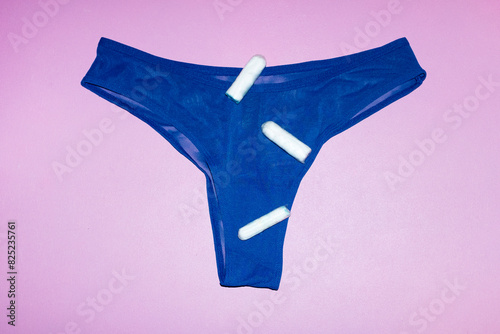 Contemporary photo of underpants and period product tampons & flash photo