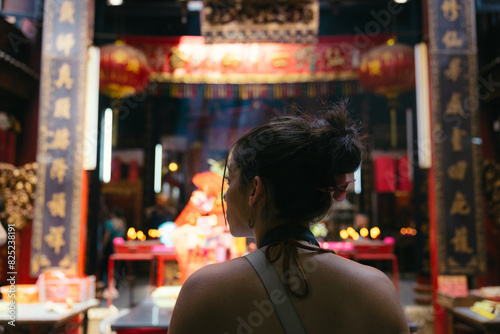 Woman visiting Sin Sze Si Ya temple in Kuala Lumpur photo