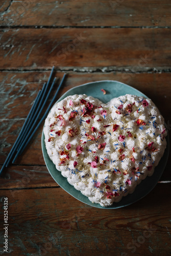 Overhead view of a heart-shaped birthday cake photo