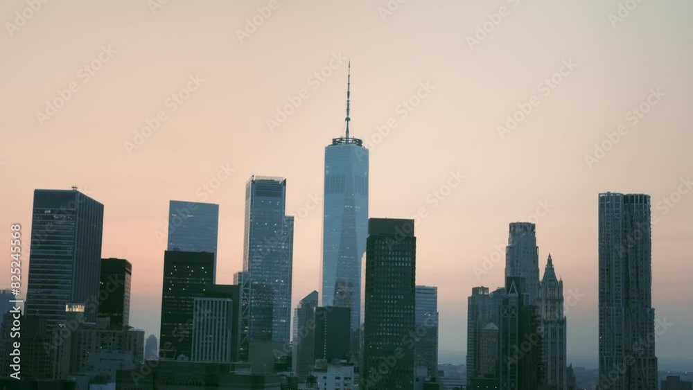 Aerial view of skyscrapers in Manhattan at pink sunset. Flying above New York with skyscrapers and bridges in the evening light. The view of Hudson river. Shot from a helicopter. Aerial view of skyscrapers in Manhattan at pink sunset. Flying above New York with skyscrapers and bridges in the evening light. The view of Hudson river. Shot from a helicopter.