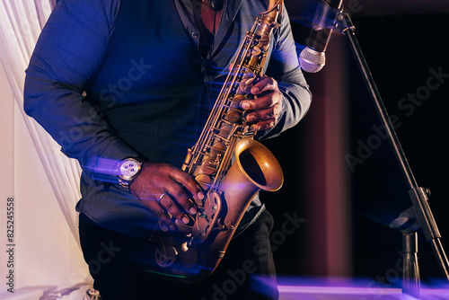 Saxophonist performing at a live music event