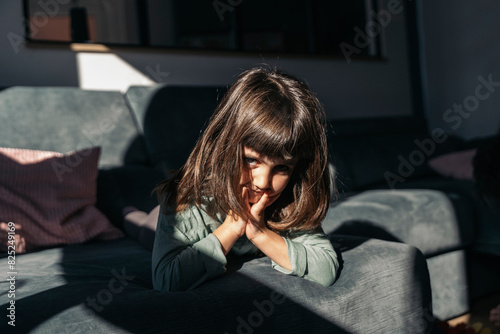 Cute portrait of toddler on the couch photo