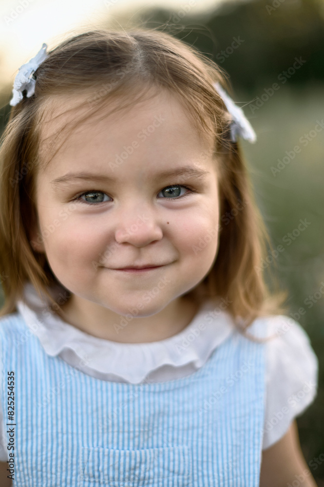 portrait of a small beautiful child in nature portrait of a small beautiful child in nature