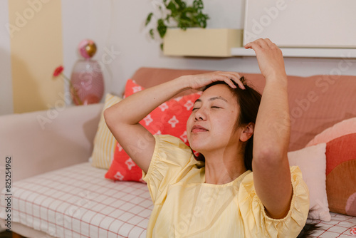 Woman Letting Down Hair at Home