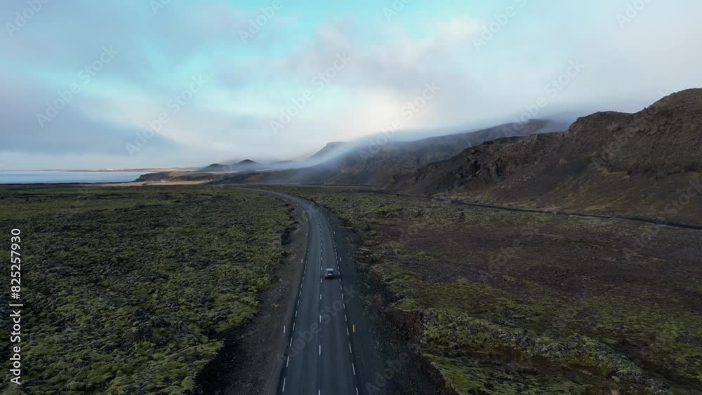 Drone shot of car driving in Iceland during winter on moss field4 Drone shot of car driving in Iceland during winter on moss field4