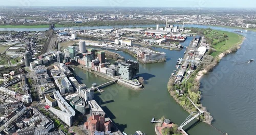 Media harbor in DUsseldorf, also the reheinturm and rhine river. Buildings, infrastructure and city overview. photo
