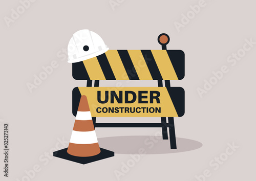 A construction zone is marked with a safety sign, cone, and hard hat