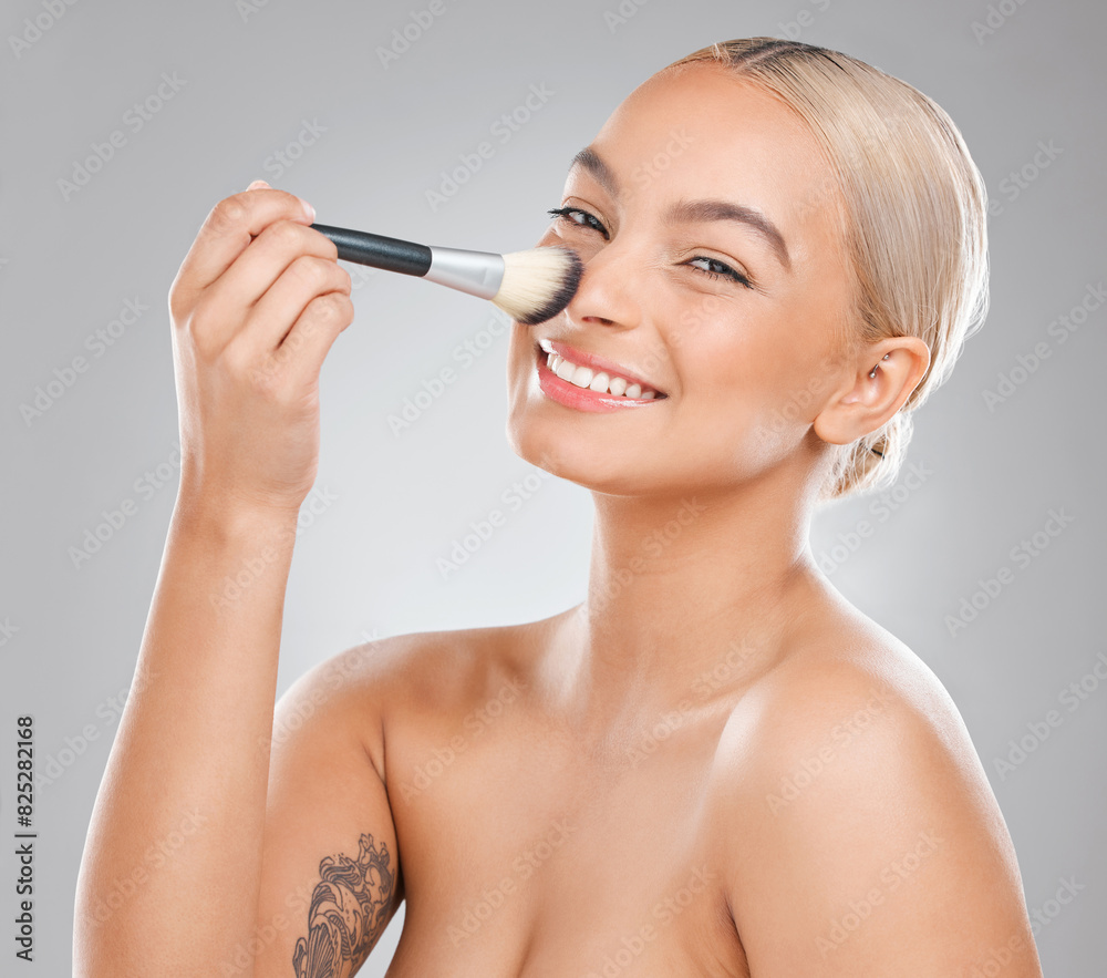 Fototapeta premium Woman, makeup brush and laugh in studio portrait with powder, nose and cosmetics by white background. Girl, person and model with tools for application, test and happy for beauty with facial change