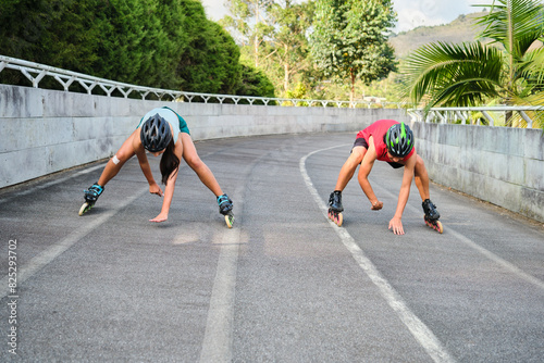 Pair of skaters warming up physically