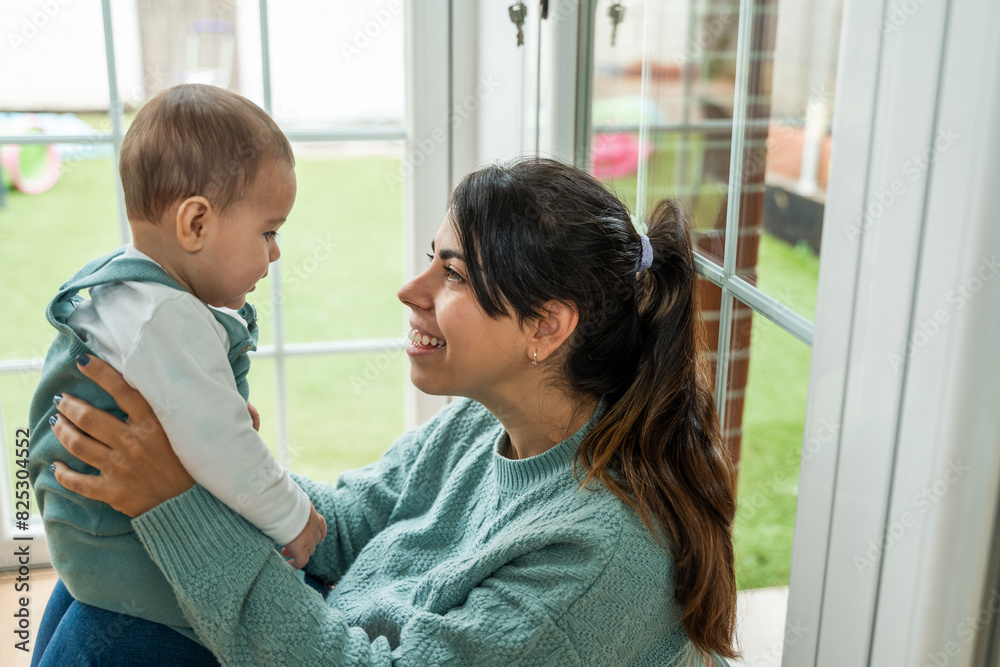 Loving mother and child enjoying time together indoors Loving mother and child enjoying time together indoors