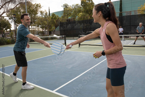 friends outside during a game of pickleball