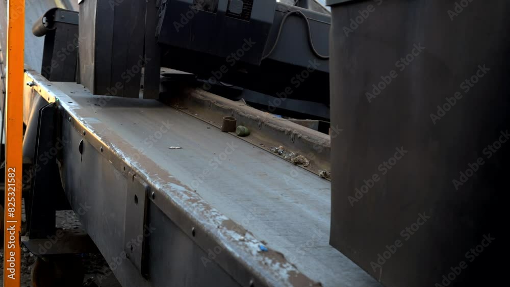 Working car shredder machine, close-up of empty conveyor belt Working car shredder machine, close-up of empty conveyor belt