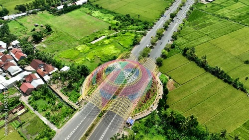 Aerial view of colorful building named Tembolak Gateway on the Lombok highway. Drone shot of iconic building of Lombok, Indonesia. photo