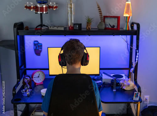 Young Boy Portrait video Gamer desk Computer at home bedroom  photo