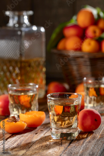 Apricot liqueur or grappa and fresh apricots.