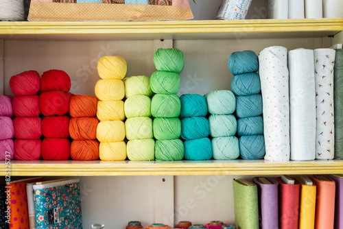 Colorful yarn balls on display at craft store photo