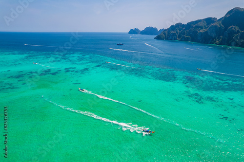 longtail boat turquoise clear water in Phi Phi, Krabi Thailand. Amazing travel landscape photo in Thai