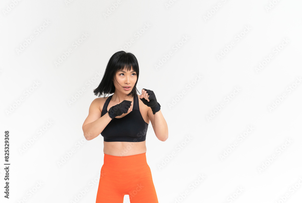 Sporty Asian Woman Boxing In Studio Sporty Asian Woman Boxing In Studio