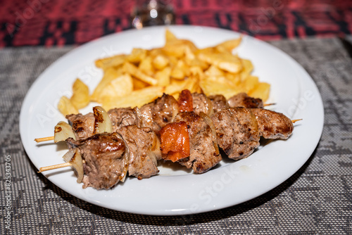 meat brochette with potatoes photo